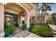 Elegant front door with decorative glass and lush landscaping enhancing curb appeal at 1988 Carolina Ne Cir, St Petersburg, FL 33703