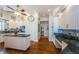 Spacious kitchen with white cabinetry, dark countertops, and stainless steel appliances at 1988 Carolina Ne Cir, St Petersburg, FL 33703