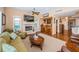 Comfortable living room with a fireplace, bar, and views of the backyard at 1988 Carolina Ne Cir, St Petersburg, FL 33703
