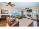 Spacious living room features water views, a fireplace, comfortable seating, and lots of natural light at 1988 Carolina Ne Cir, St Petersburg, FL 33703