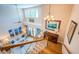 Open-concept living room with high ceilings, large windows, and a stylish chandelier, perfect for gatherings at 1988 Carolina Ne Cir, St Petersburg, FL 33703