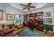 Cozy office space with custom built-ins, a desk, a reading nook, and a calming view at 1988 Carolina Ne Cir, St Petersburg, FL 33703