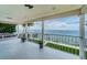 Spacious covered patio with a serene view of the water, ideal for outdoor dining and relaxation at 1988 Carolina Ne Cir, St Petersburg, FL 33703