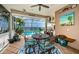 Enclosed pool area with outdoor seating, tropical plants, and views of the ocean at 1988 Carolina Ne Cir, St Petersburg, FL 33703