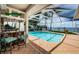 Outdoor pool with a covered patio, seating, and access to a tranquil ocean view at 1988 Carolina Ne Cir, St Petersburg, FL 33703