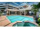 View of the swimming pool, spa and lanai of this stunning home at 1988 Carolina Ne Cir, St Petersburg, FL 33703