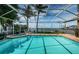Gorgeous pool with lovely landscaping and a beautiful view of the ocean and the neighborhood dock at 1988 Carolina Ne Cir, St Petersburg, FL 33703