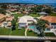 Waterfront home boasting a screened-in pool, lush yard, and outdoor seating for relaxation with bay views at 1988 Carolina Ne Cir, St Petersburg, FL 33703