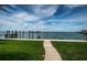 A concrete path leads to a waterfront view at 1988 Carolina Ne Cir, St Petersburg, FL 33703