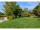 The backyard is landscaped and features beautiful lake views at 2035 Nolan Dr, Dunedin, FL 34698