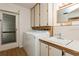 The laundry room includes a sink, a door to the outside, and a washing machine at 2035 Nolan Dr, Dunedin, FL 34698