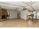 Spacious living area boasts a stone fireplace, built-in shelving, and breakfast bar at 2035 Nolan Dr, Dunedin, FL 34698