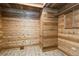 This room features wood-paneled walls, a skylight, and wood-look floors at 2035 Nolan Dr, Dunedin, FL 34698