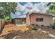 View of the fenced backyard with access to the screened in pool area at 2063 Ridgecrest Dr, Dunedin, FL 34698