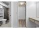 Hallway view into the bathroom, walk-in closet, and vanity at 2063 Ridgecrest Dr, Dunedin, FL 34698