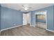 This bedroom has modern flooring and an open closet with mirrored doors at 2063 Ridgecrest Dr, Dunedin, FL 34698