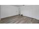 This bedroom features gray flooring and a closet with sliding doors at 2063 Ridgecrest Dr, Dunedin, FL 34698
