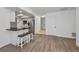 A sleek kitchen with stainless steel appliances, white cabinets, and a breakfast bar area at 2063 Ridgecrest Dr, Dunedin, FL 34698