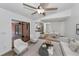 An open living area with fireplace, kitchen access, and view of the pool area at 2063 Ridgecrest Dr, Dunedin, FL 34698