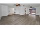 A well-lit empty living room showcasing the wood-look floors and open floor plan at 2063 Ridgecrest Dr, Dunedin, FL 34698