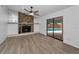 Inviting living room with a striking stone fireplace and sliding glass doors to the pool at 2063 Ridgecrest Dr, Dunedin, FL 34698