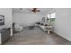 Open concept living room with hardwood floors, modern furnishings, and plenty of natural light at 2063 Ridgecrest Dr, Dunedin, FL 34698