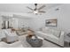 Spacious living room leading to dining area and kitchen, with comfortable seating at 2063 Ridgecrest Dr, Dunedin, FL 34698