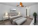 Serene main bedroom with natural light, plush bedding, and ensuite bathroom access at 2063 Ridgecrest Dr, Dunedin, FL 34698