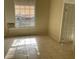 Living room featuring tile flooring and a large window at 2219 Durham St, Tampa, FL 33605