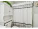 Shower featuring modern gray and white shower curtain at 2261 Swedish Dr # 47, Clearwater, FL 33763