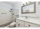 Clean bathroom with walk-in shower, white vanity, and updated fixtures at 2261 Swedish Dr # 47, Clearwater, FL 33763