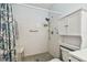 Bathroom featuring a walk-in shower with handrails and seat at 2261 Swedish Dr # 47, Clearwater, FL 33763