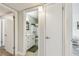Bathroom with white cabinetry and modern fixtures viewed from hallway at 2261 Swedish Dr # 47, Clearwater, FL 33763