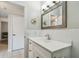 Bathroom featuring a vanity with a large mirror and modern fixtures at 2261 Swedish Dr # 47, Clearwater, FL 33763