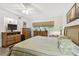 Bright bedroom with a ceiling fan and natural light from a window at 2261 Swedish Dr # 47, Clearwater, FL 33763