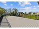 Spacious outdoor deck area offers a scenic place to relax and enjoy the surrounding natural beauty and partial community views at 2261 Swedish Dr # 47, Clearwater, FL 33763