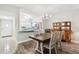 Cozy dining area with wood floors adjacent to the kitchen and living room at 2261 Swedish Dr # 47, Clearwater, FL 33763
