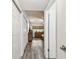 Hallway leading to the bedroom featuring hardwood floors at 2261 Swedish Dr # 47, Clearwater, FL 33763