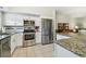 Bright kitchen featuring stainless steel appliances, granite countertops, and ample cabinet space at 2261 Swedish Dr # 47, Clearwater, FL 33763