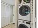 Efficient laundry area with stacked washer and dryer, plus extra storage at 2261 Swedish Dr # 47, Clearwater, FL 33763