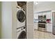 Convenient laundry area with stacked washer and dryer near the kitchen at 2261 Swedish Dr # 47, Clearwater, FL 33763