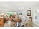 Open concept living and dining area featuring wood flooring and a neutral color palette at 2261 Swedish Dr # 47, Clearwater, FL 33763