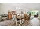 Open concept living and dining area with wood floors, chandelier, and comfortable seating at 2261 Swedish Dr # 47, Clearwater, FL 33763