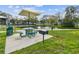 Inviting picnic area with a grill, table, and scenic pond views, perfect for outdoor dining and community gatherings at 2261 Swedish Dr # 47, Clearwater, FL 33763