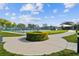 Well-maintained community tennis courts surrounded by lush landscaping and a walking path for active recreation at 2261 Swedish Dr # 47, Clearwater, FL 33763