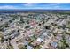 Aerial view of a community highlighting the property's location within a well-established neighborhood with mature trees at 260 Venice East Blvd, Venice, FL 34293