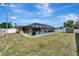 Spacious backyard with a screened-in pool and a shed provides an inviting outdoor oasis at 260 Venice East Blvd, Venice, FL 34293