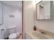 Clean half-bathroom featuring a toilet and vanity with modern fixtures at 260 Venice East Blvd, Venice, FL 34293