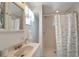 Bright bathroom with stand-up shower features neutral finishes and fixtures at 260 Venice East Blvd, Venice, FL 34293