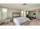 Bright bedroom featuring neutral decor, carpeting, and a flex room with exercise equipment at 260 Venice East Blvd, Venice, FL 34293